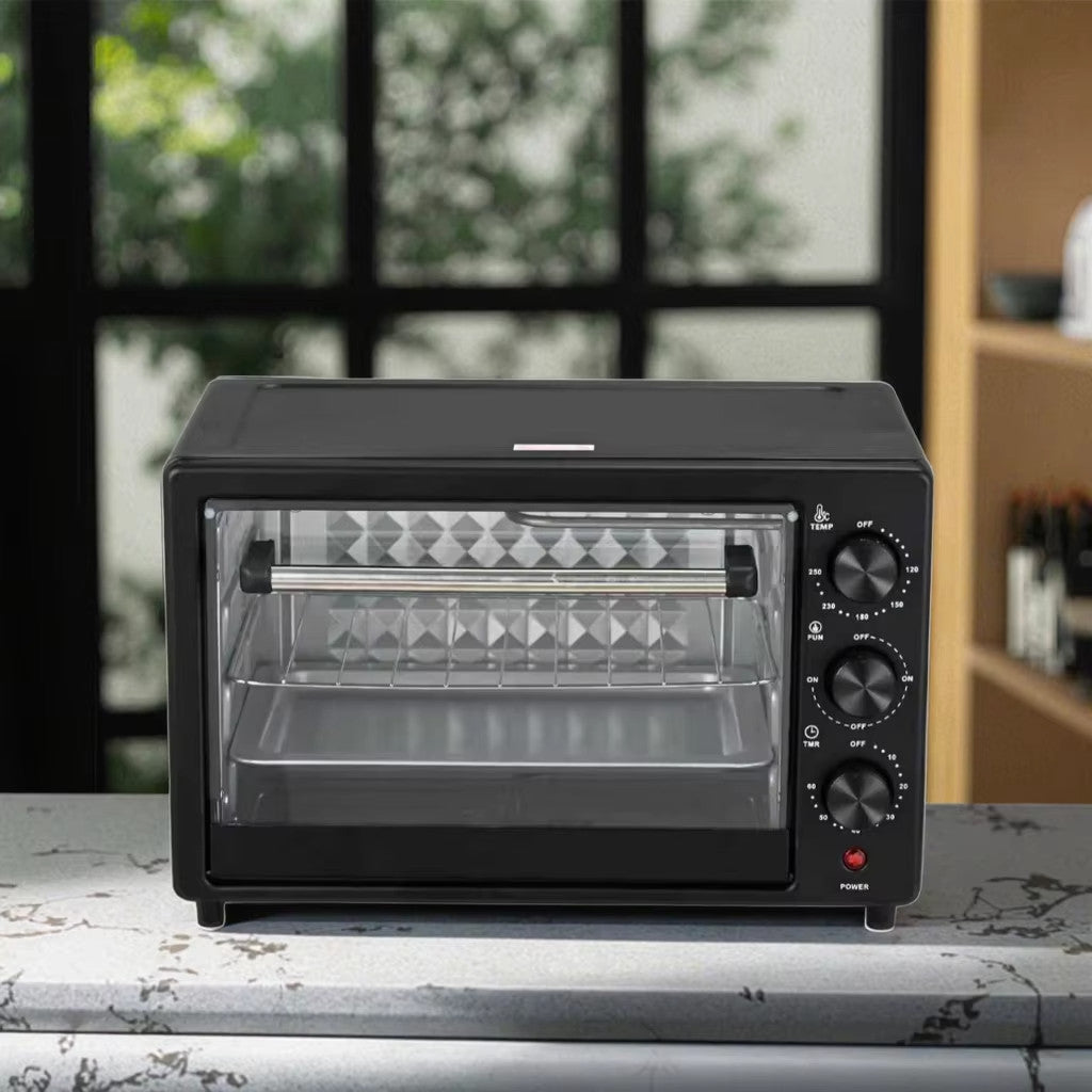 Black toaster oven on a kitchen counter with a blurred background