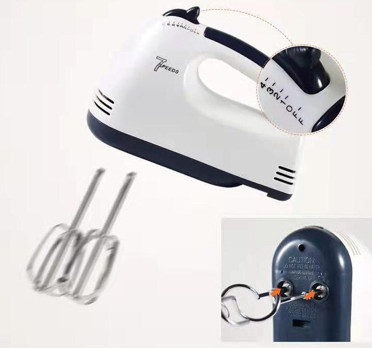 Hand mixer with attachments on a white background