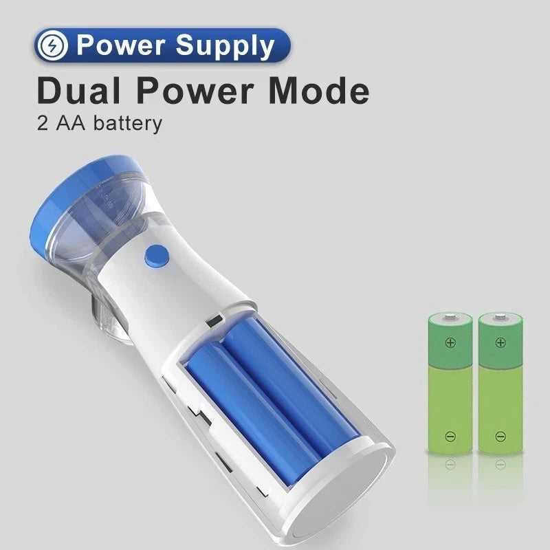 Handheld vacuum cleaner with dual power mode and two AA batteries on a gray background