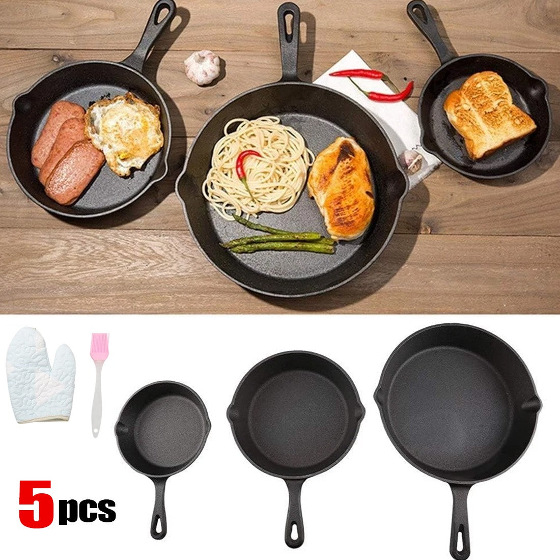 Set of five cast iron skillets with various food items on a wooden surface, including sausages, eggs, pasta, and toast.