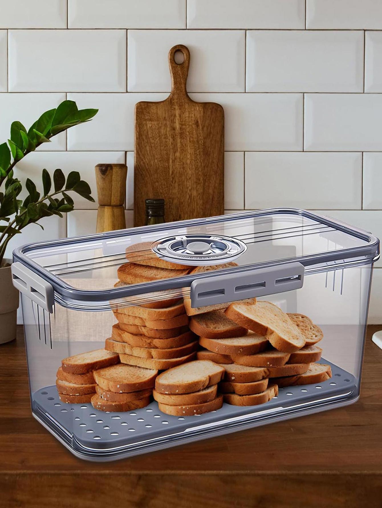 Clear container with sliced bread on a kitchen counter