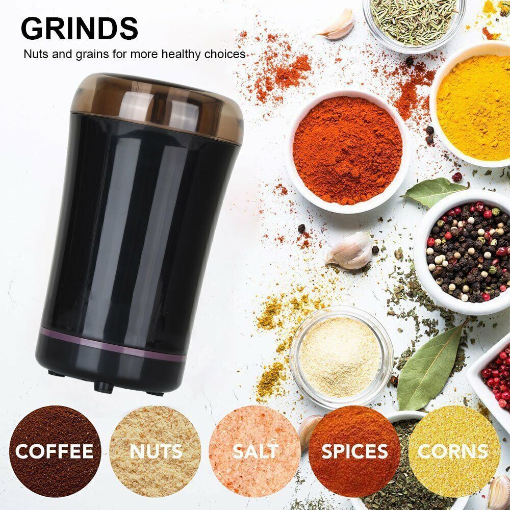 Black spice grinder with bowls of spices and labeled categories on a white background