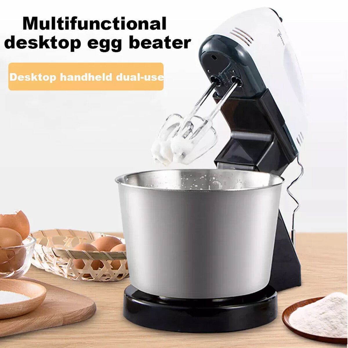 Multifunctional desktop egg beater with a metal bowl on a wooden surface, surrounded by eggs and flour.