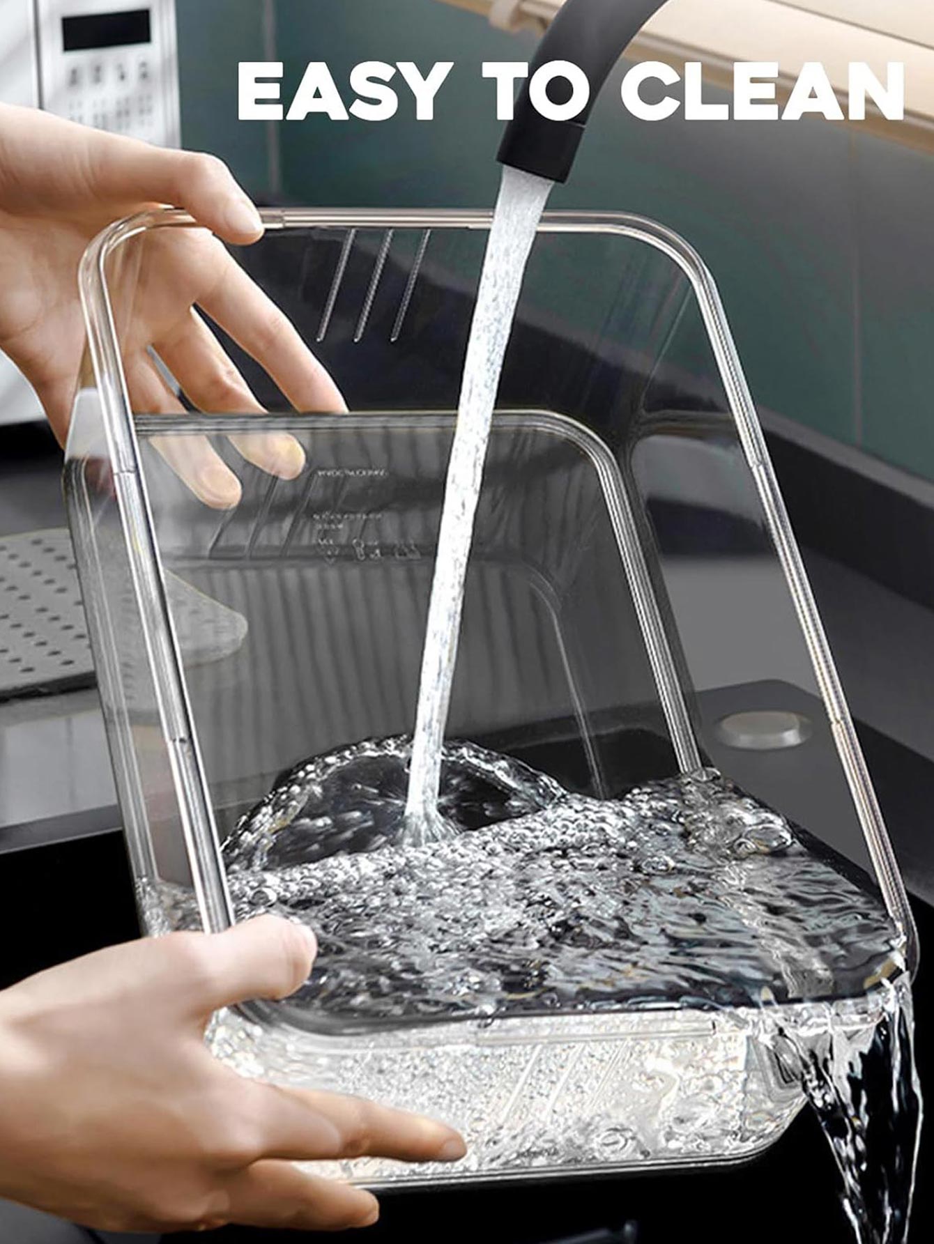 Person washing a transparent container with water, emphasizing ease of cleaning.