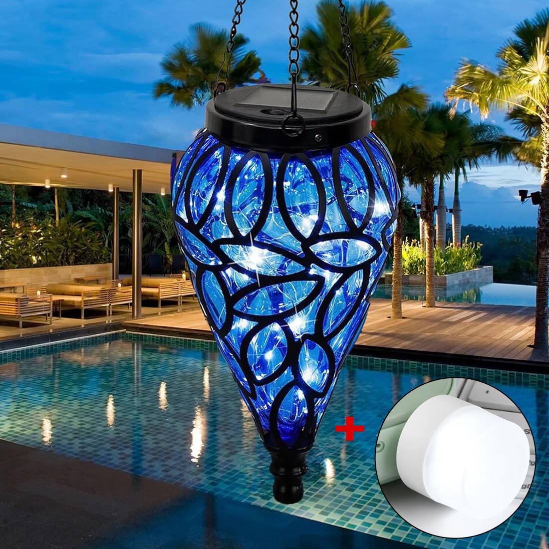Decorative blue solar light hanging over a pool with palm trees in the background