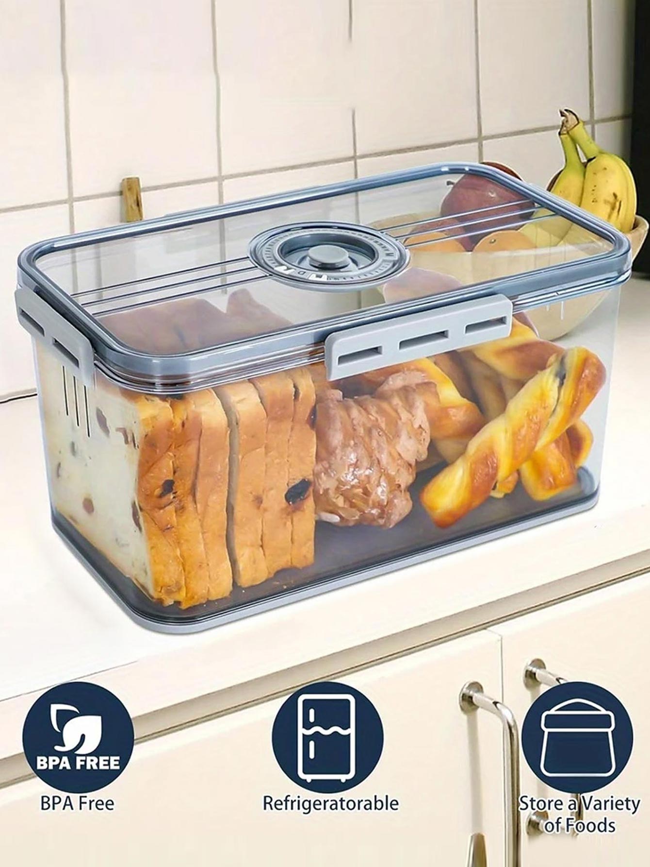 Clear food storage container with food items on a kitchen counter, featuring BPA-free, refrigeratorable, and versatile food storage icons.
