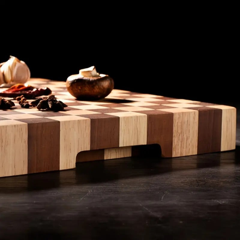 Wooden cutting board with checkered pattern on a dark surface
