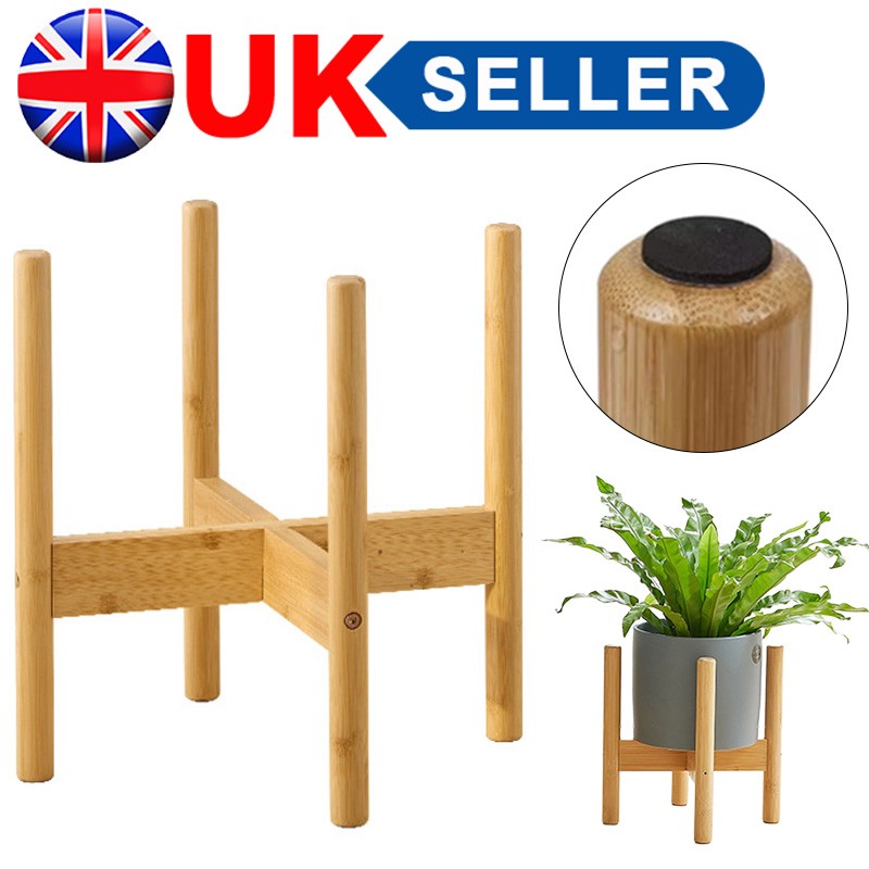 Bamboo plant stand with a close-up of a pot holder and a potted plant on a white background.